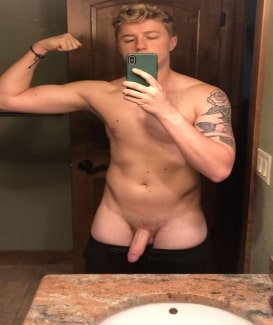 Flexing boy with a cut cock