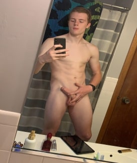 Nude boy in the mirror