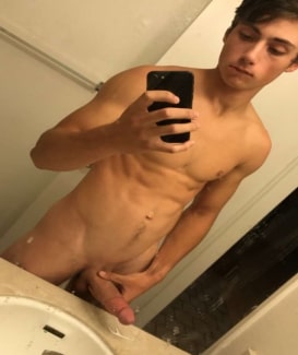Nude boy taking a selfie